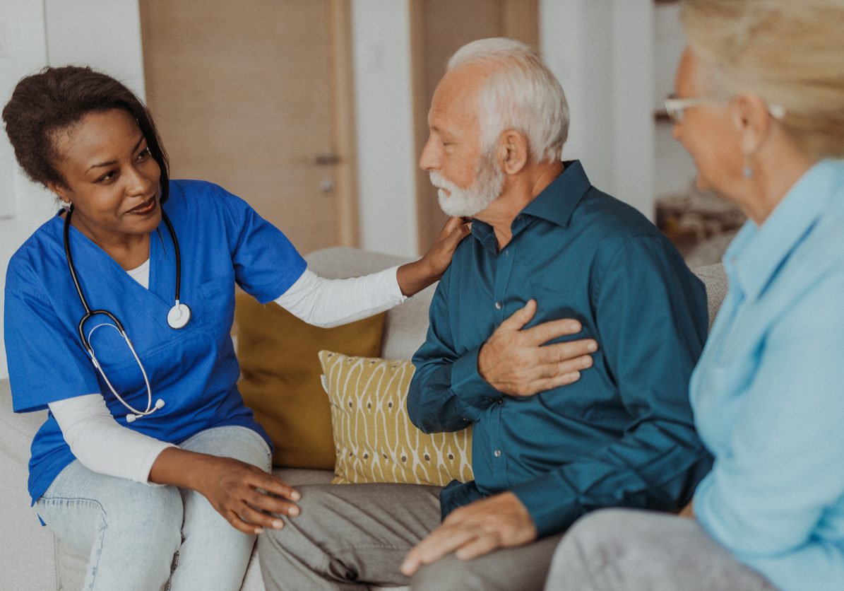 Doctor visiting senior couple